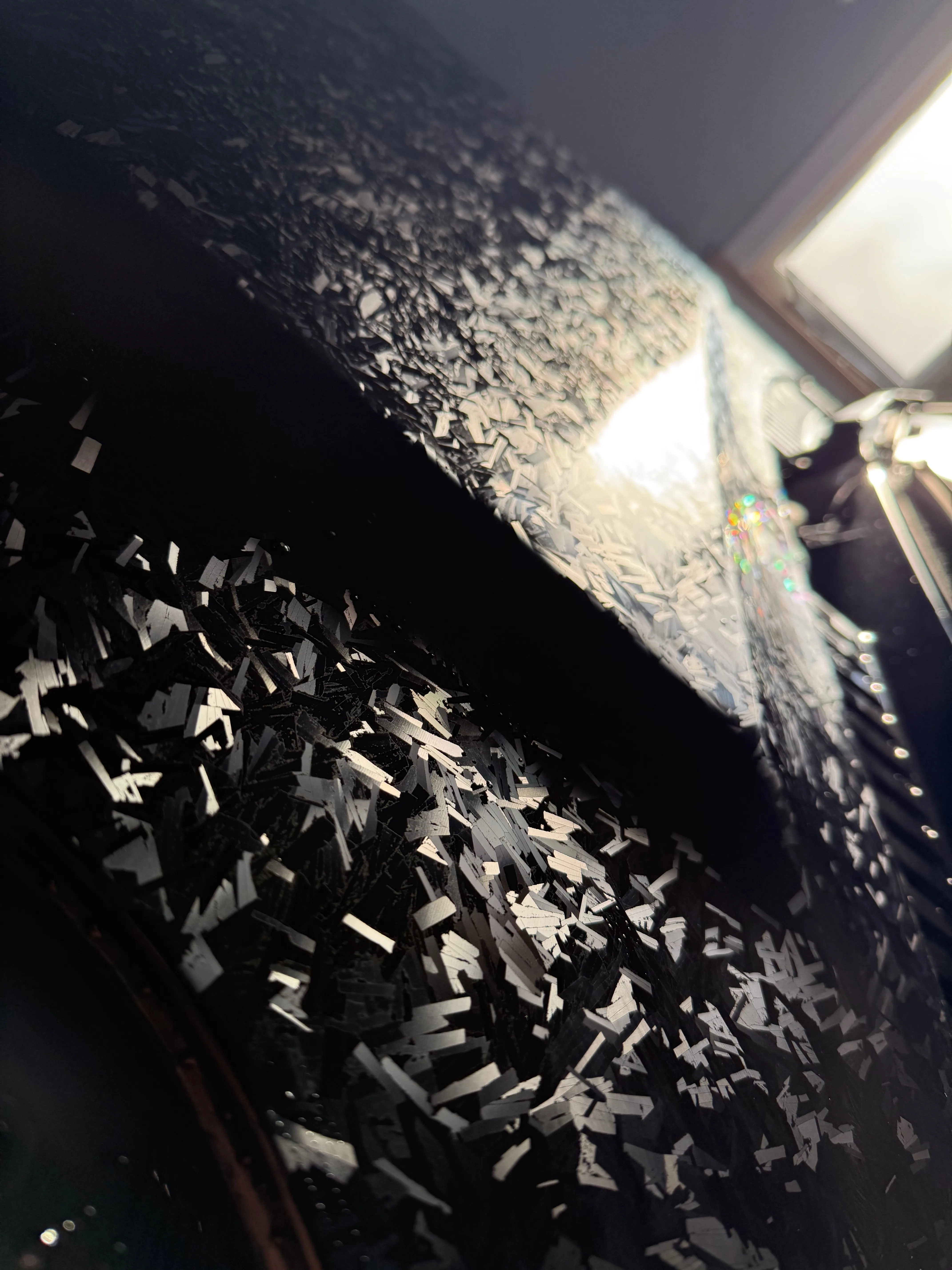 Forged carbon PPF close-up showing randomized carbon fibre pattern catching light